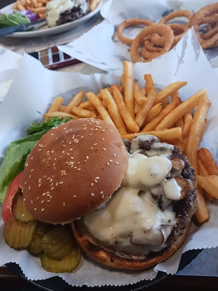 Mushroom and Swiss burger smothered in sauteed mushrooms and melted Swiss cheese